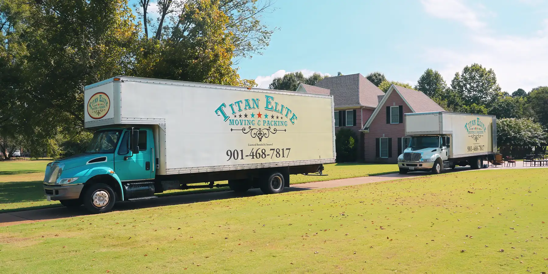 Titan Elite moving trucks at a Memphis home